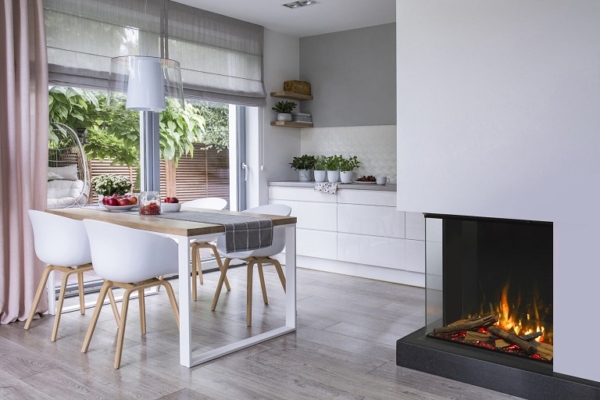 Real photo of a dining table, chairs and kitchen interior. Storage for fireplace wood. Empty wall, place for your poster